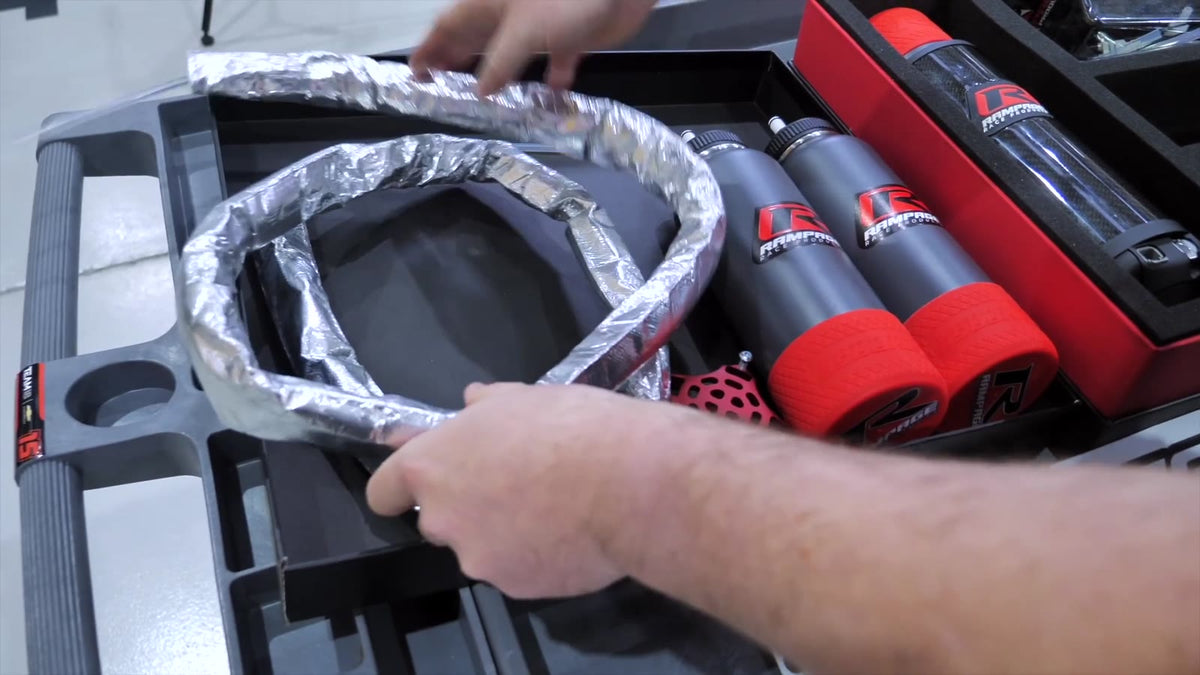 RamHydrate race car drink system kit unboxed in the Team 18 workshop: pump unit, insulated bottles, mounts and insulated hose