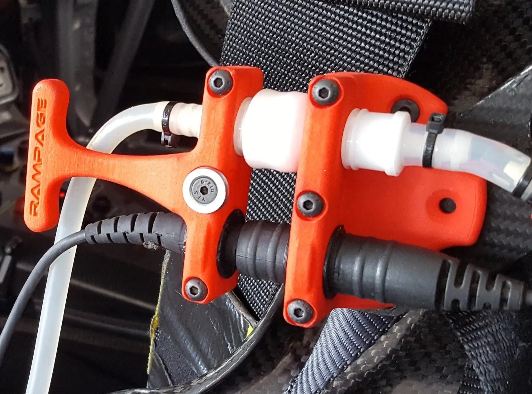 RamConnect quick-release connection kit installed in a race car - radio, drink and cool suit in one plug