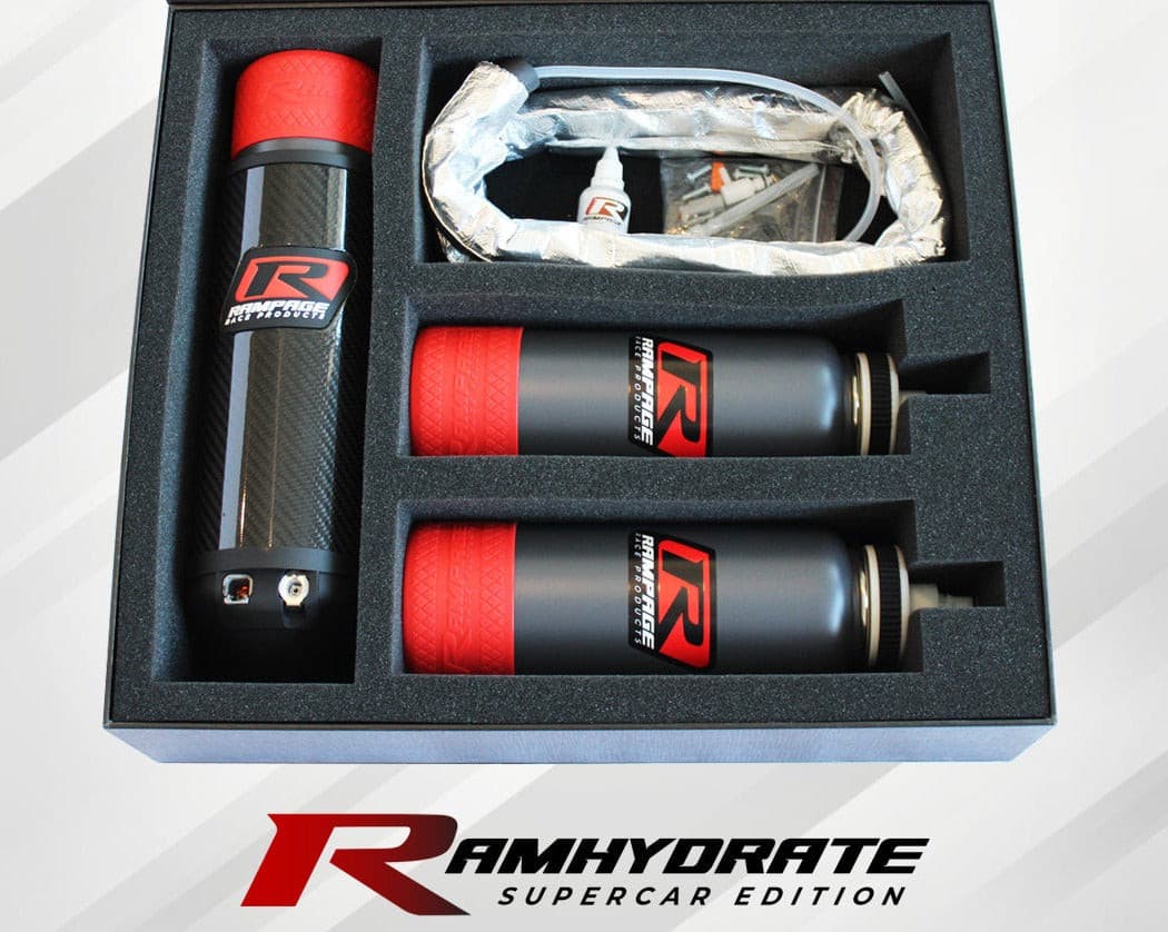 Race car Drink system Hydration Thirst Refreshment Water bottle Fluid intake Sports drink Performance Endurance Speed Mechanism Tubing Nozzle Driver Cockpit Fuel Pit stop Racing technology Sports equipment